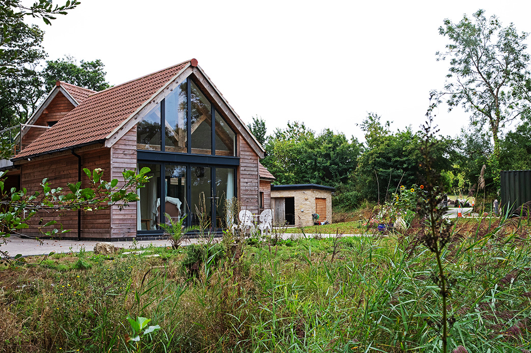 slide: Harmony with nature Rural woodland new build