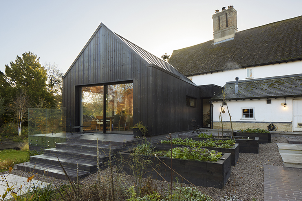slide: Black clad farmhouse extension Black box beauty