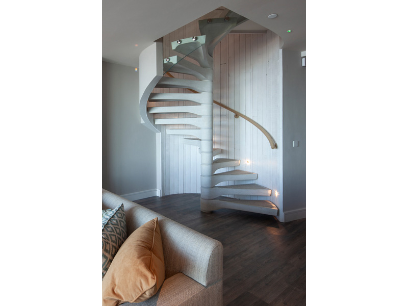 Steel handrail wrapped in rope in a staircase and balustrade package from Spiral UK  (spiral.uk.com)