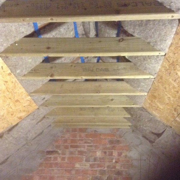 Passivehouse-retrofit-roof-insulation-boards-above-rafters.jpg